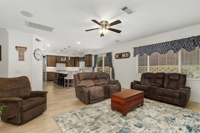 35183 Flamingo Way, Winchester, CA 92596 - living room featuring a ceiling fan, light wood-type flooring, ornamental molding, plenty of natural light, and recessed lighting