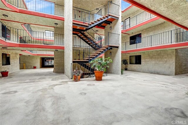 view of property featuring stairs