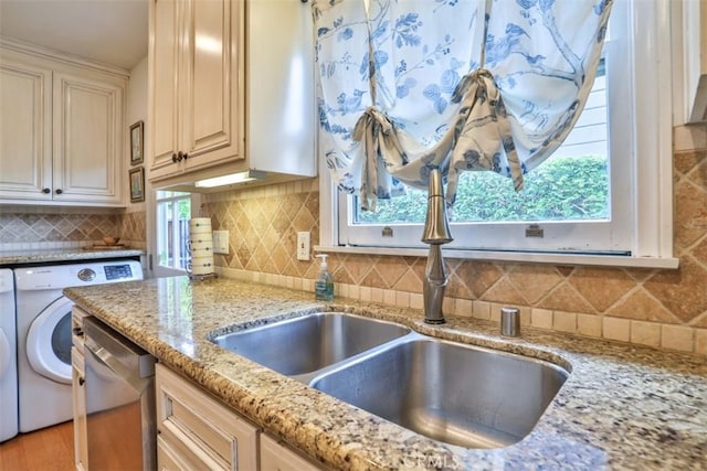 1956 E Woodlyn Rd, Pasadena, CA 91104 - kitchen featuring stainless steel dishwasher, washing machine and clothes dryer, light stone counters, a sink, and tasteful backsplash