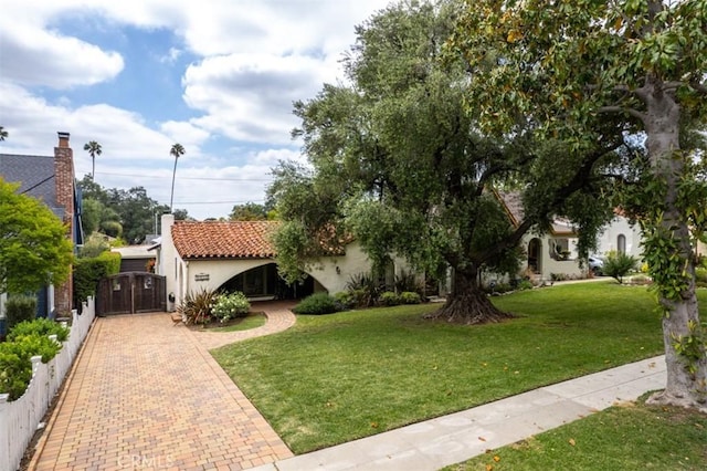 1956 E Woodlyn Rd, Pasadena, CA 91104 - view of front of home with stucco siding, decorative driveway, and a front lawn