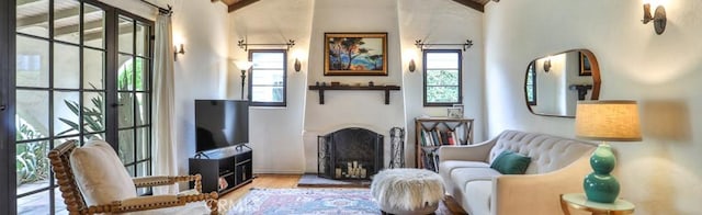 1956 E Woodlyn Rd, Pasadena, CA 91104 - sitting room featuring a fireplace with raised hearth and wood finished floors