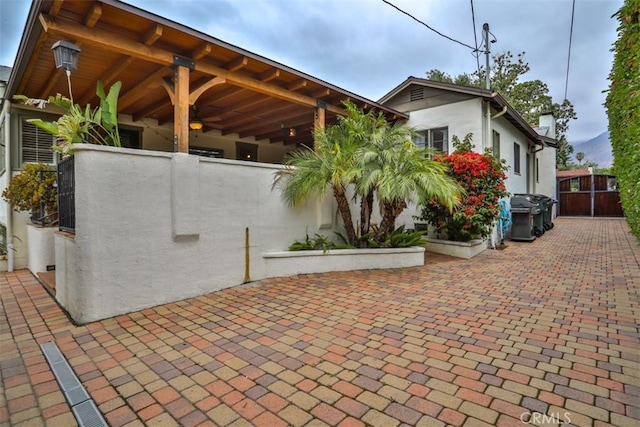 1956 E Woodlyn Rd, Pasadena, CA 91104 - exterior space with a patio, decorative driveway, stucco siding, and fence