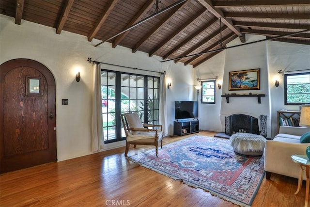 1956 E Woodlyn Rd, Pasadena, CA 91104 - living area featuring wood ceiling, plenty of natural light, arched walkways, and wood finished floors