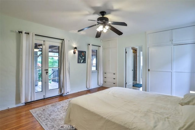1956 E Woodlyn Rd, Pasadena, CA 91104 - bedroom featuring multiple closets, access to exterior, a ceiling fan, baseboards, and wood finished floors