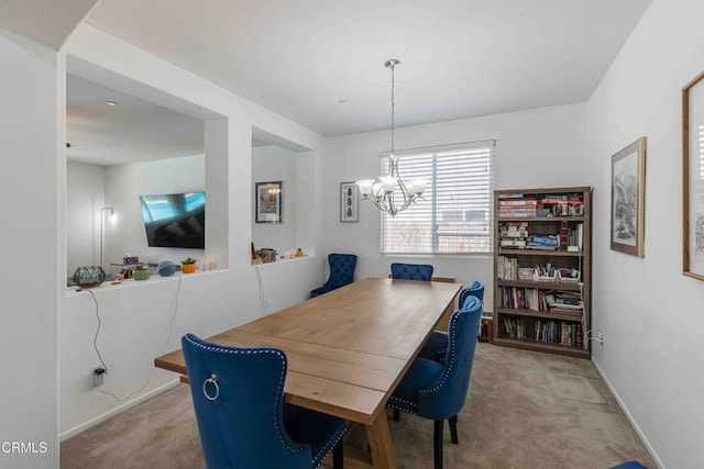 10909 Rainwater Ln, Bakersfield, CA 93306 - carpeted dining room with a notable chandelier and baseboards
