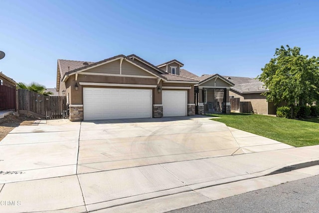 10909 Rainwater Ln, Bakersfield, CA 93306 - craftsman inspired home with concrete driveway, stone siding, stucco siding, an attached garage, and fence