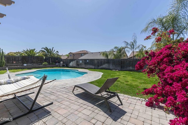10909 Rainwater Ln, Bakersfield, CA 93306 - view of swimming pool with a lawn, a patio area, a fenced in pool, and a fenced backyard