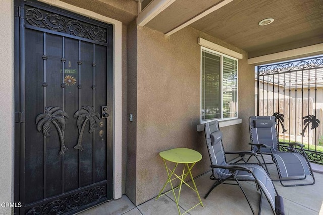 10909 Rainwater Ln, Bakersfield, CA 93306 - property entrance featuring a porch and stucco siding