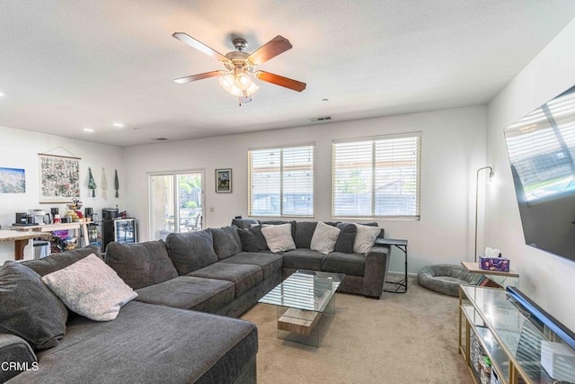 10909 Rainwater Ln, Bakersfield, CA 93306 - living area with a ceiling fan, visible vents, light colored carpet, and plenty of natural light