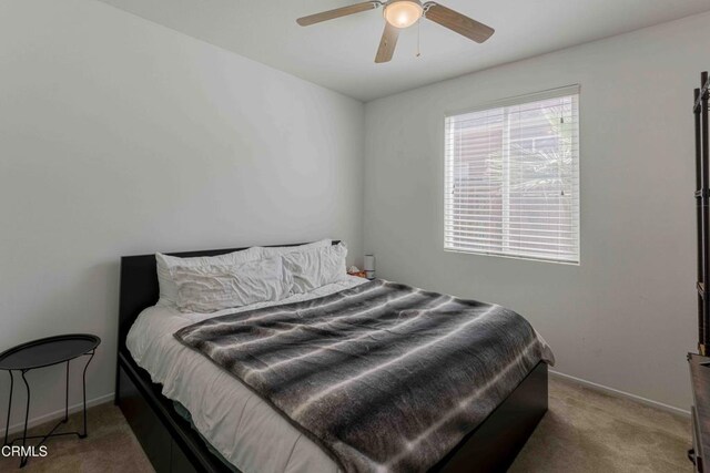 10909 Rainwater Ln, Bakersfield, CA 93306 - carpeted bedroom with baseboards and ceiling fan