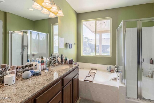10909 Rainwater Ln, Bakersfield, CA 93306 - full bath with vanity, a stall shower, and a garden tub
