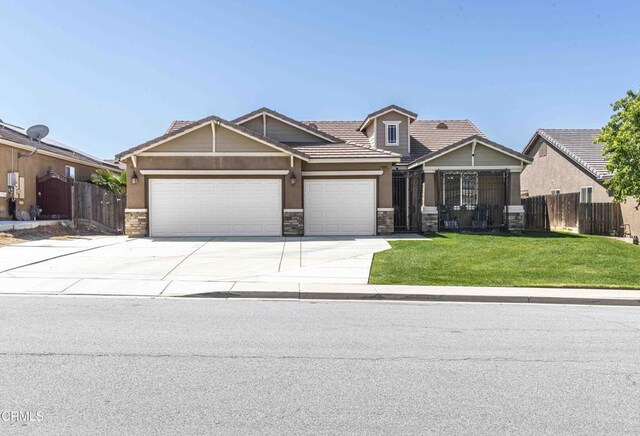 10909 Rainwater Ln, Bakersfield, CA 93306 - craftsman house featuring stone siding, driveway, a garage, and a tiled roof