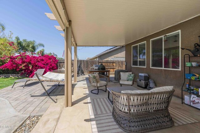 10909 Rainwater Ln, Bakersfield, CA 93306 - fenced backyard with an outdoor hangout area and a patio area