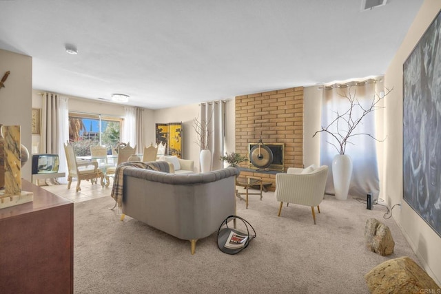 living area with carpet and a brick fireplace