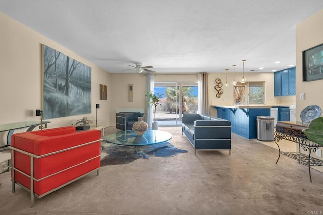 living room featuring a ceiling fan, concrete floors, and recessed lighting