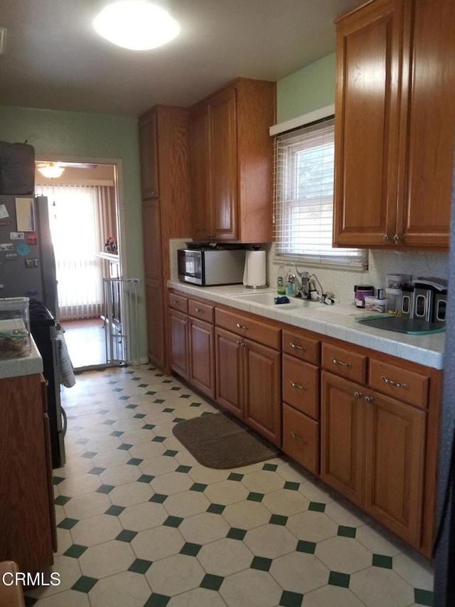431 Eva St, Ventura, CA 93003 - kitchen with stainless steel microwave and brown cabinetry