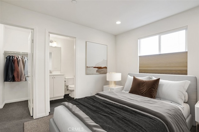 15331 Jasmine Ln Unit 105, Gardena, CA 90249 - bedroom featuring a walk in closet, a closet, dark carpet, baseboards, and ensuite bathroom