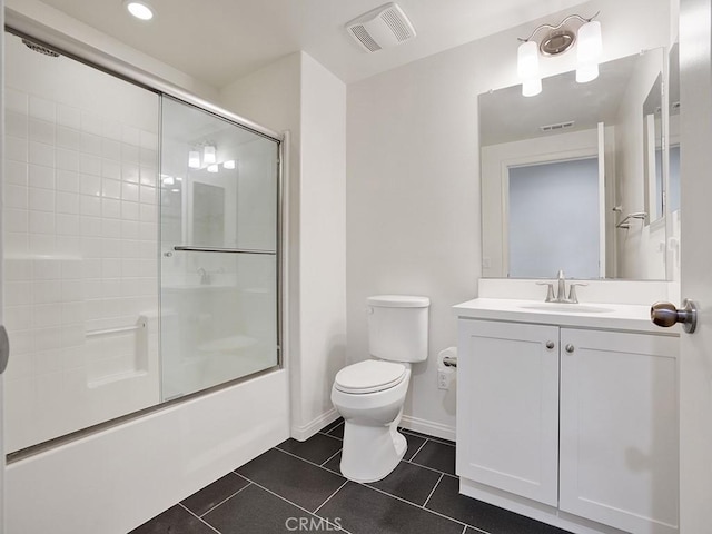 15331 Jasmine Ln Unit 105, Gardena, CA 90249 - full bathroom with tile patterned flooring, toilet, vanity, enclosed tub / shower combo, and baseboards