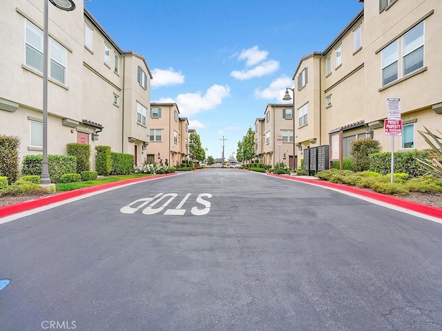 15331 Jasmine Ln Unit 105, Gardena, CA 90249 - view of asphalt road with a residential view, street lights, and curbs