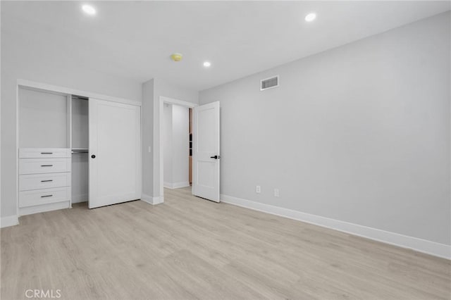 20500 Blairmoore St, Chatsworth, CA 91311 - unfurnished bedroom with baseboards, light wood finished floors, recessed lighting, and a closet