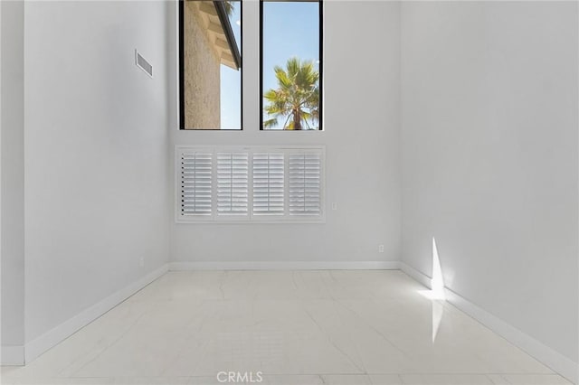 20500 Blairmoore St, Chatsworth, CA 91311 - empty room featuring marble finish flooring and baseboards