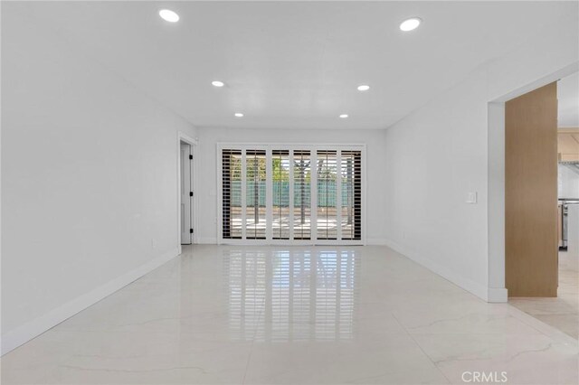 20500 Blairmoore St, Chatsworth, CA 91311 - empty room with recessed lighting, baseboards, and marble finish floors