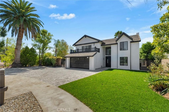 20500 Blairmoore St, Chatsworth, CA 91311 - view of front of property featuring a balcony, decorative driveway, stucco siding, and a garage