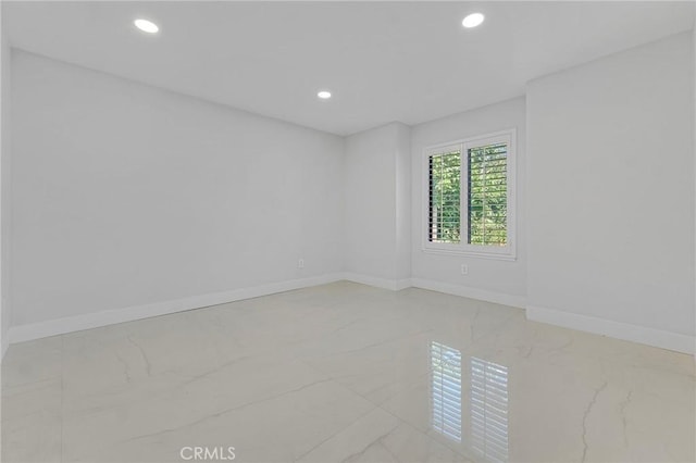20500 Blairmoore St, Chatsworth, CA 91311 - spare room featuring marble tiled flooring, recessed lighting, and baseboards