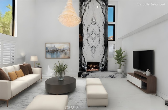 20500 Blairmoore St, Chatsworth, CA 91311 - living area with a high ceiling, plenty of natural light, and a high end fireplace