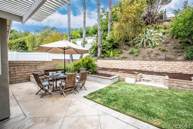 exterior space featuring fence and outdoor dining space