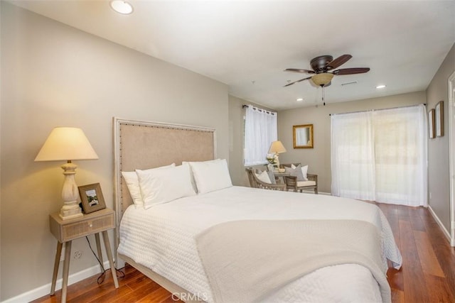 bedroom featuring recessed lighting, ceiling fan, wood finished floors, and baseboards