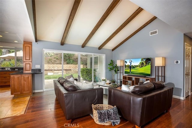 living area featuring beamed ceiling, visible vents, dark wood-style flooring, and baseboards