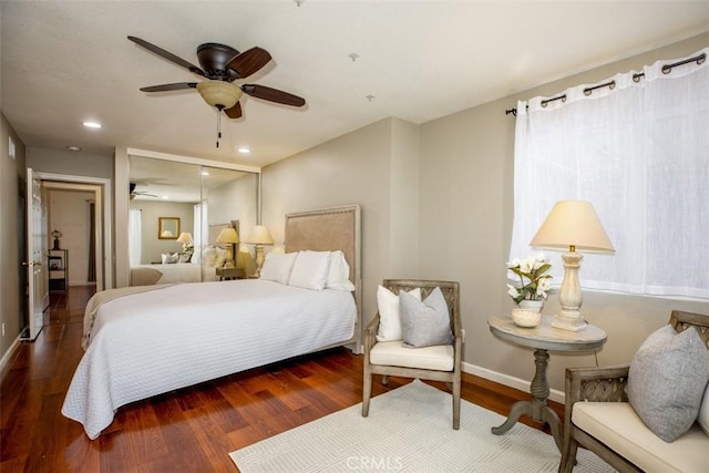 bedroom with wood finished floors, recessed lighting, and baseboards