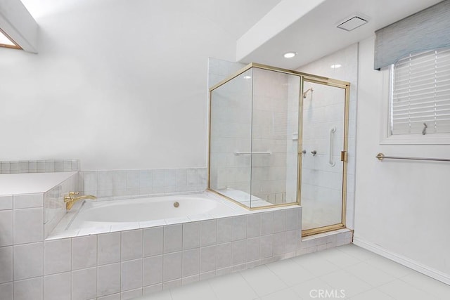 full bath with a shower stall, baseboards, recessed lighting, a garden tub, and tile patterned flooring