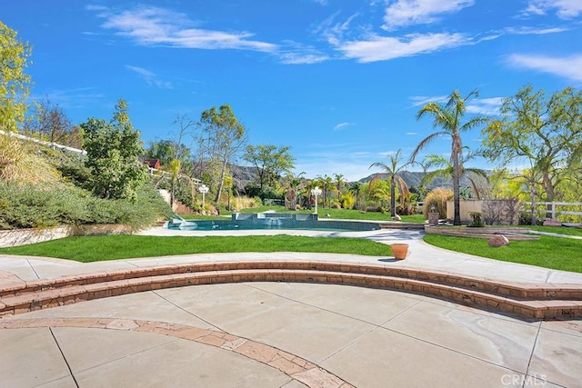 view of home's community with a yard