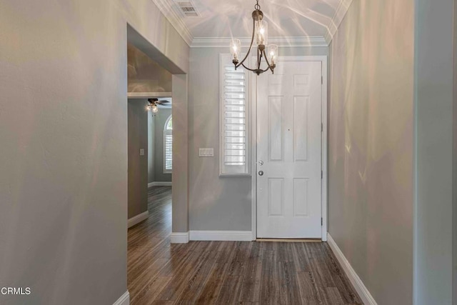 entryway featuring visible vents, baseboards, an inviting chandelier, ornamental molding, and dark wood-type flooring