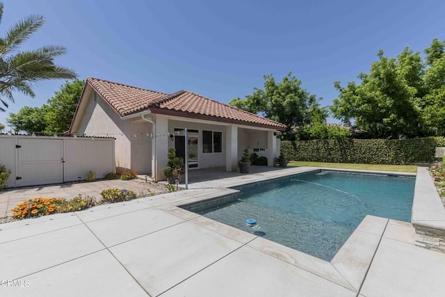 view of pool with fence, a gate, a patio area, and a fenced in pool
