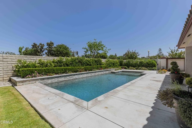 view of pool featuring a patio, a fenced backyard, and a fenced in pool