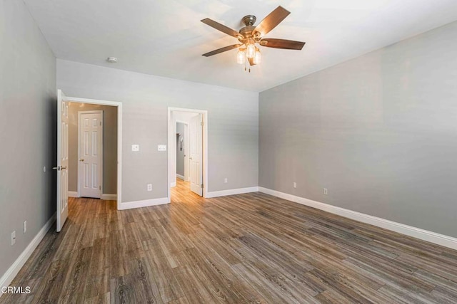 unfurnished bedroom with wood finished floors, a ceiling fan, and baseboards