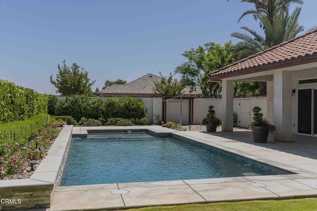 view of swimming pool featuring a patio, fence, and a fenced in pool
