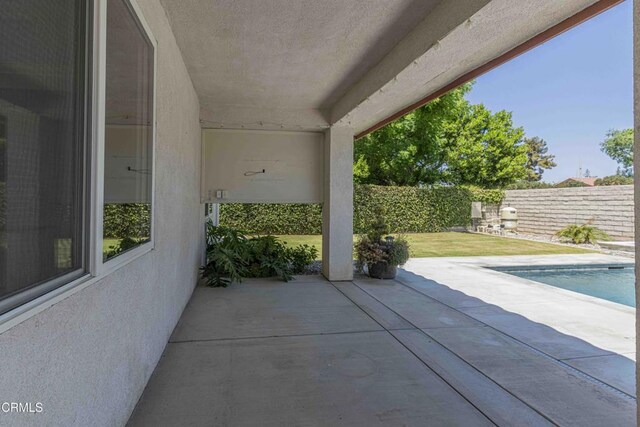 view of patio with a fenced in pool and a fenced backyard