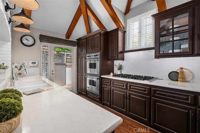 421 High Dr, Laguna Beach, CA 92651 - kitchen featuring stainless steel appliances, a sink, light countertops, and dark brown cabinets