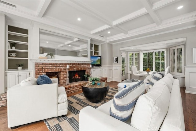 421 High Dr, Laguna Beach, CA 92651 - living room featuring coffered ceiling, wood finished floors, a decorative wall, a fireplace, and ornamental molding