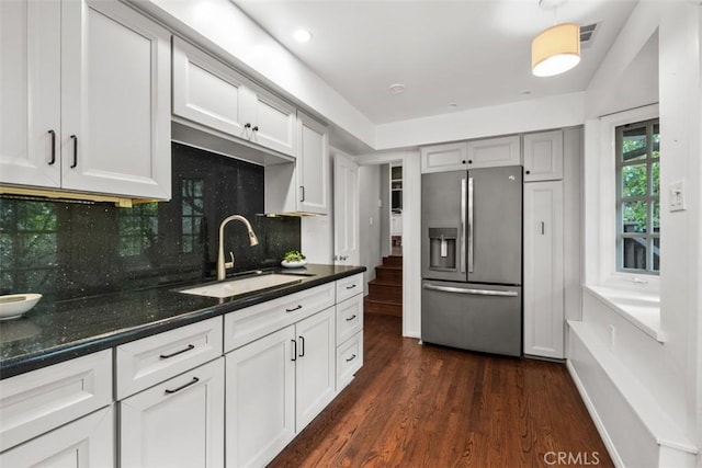 421 High Dr, Laguna Beach, CA 92651 - kitchen featuring stainless steel fridge with ice dispenser, a sink, dark wood-style floors, backsplash, and white cabinetry