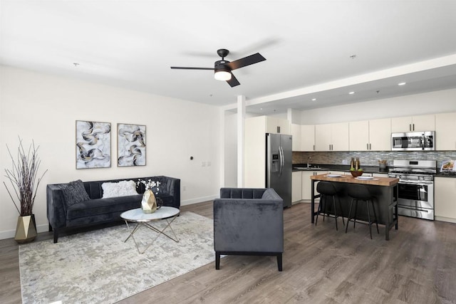 1551 4th Ave Unit 611, San Diego, CA 92101 - living room featuring baseboards, a ceiling fan, recessed lighting, and wood finished floors