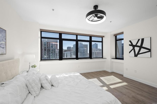 1551 4th Ave Unit 611, San Diego, CA 92101 - bedroom with baseboards and wood finished floors