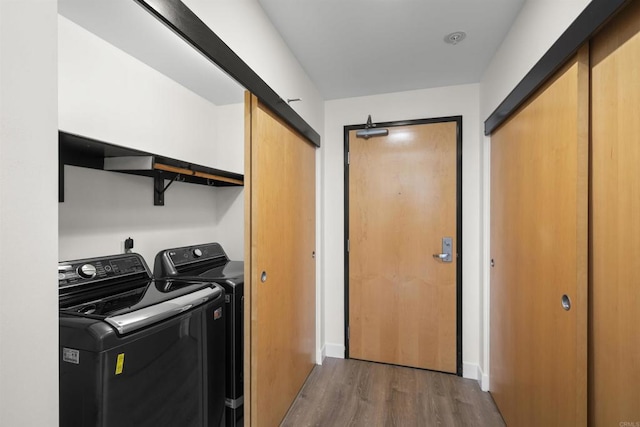 1551 4th Ave Unit 611, San Diego, CA 92101 - laundry area with independent washer and dryer, dark wood-style flooring, and laundry area