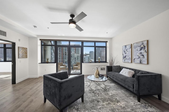 1551 4th Ave Unit 611, San Diego, CA 92101 - living area featuring baseboards, a ceiling fan, and wood finished floors