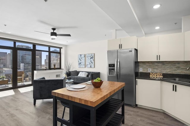 1551 4th Ave Unit 611, San Diego, CA 92101 - kitchen with ceiling fan, stainless steel refrigerator with ice dispenser, tasteful backsplash, a sink, and light wood finished floors