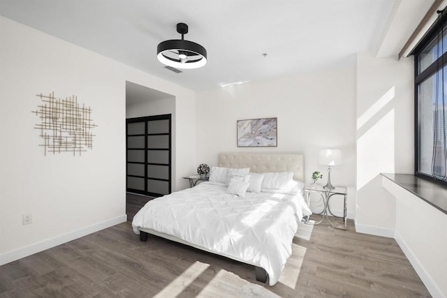 1551 4th Ave Unit 611, San Diego, CA 92101 - bedroom with baseboards, wood finished floors, and visible vents